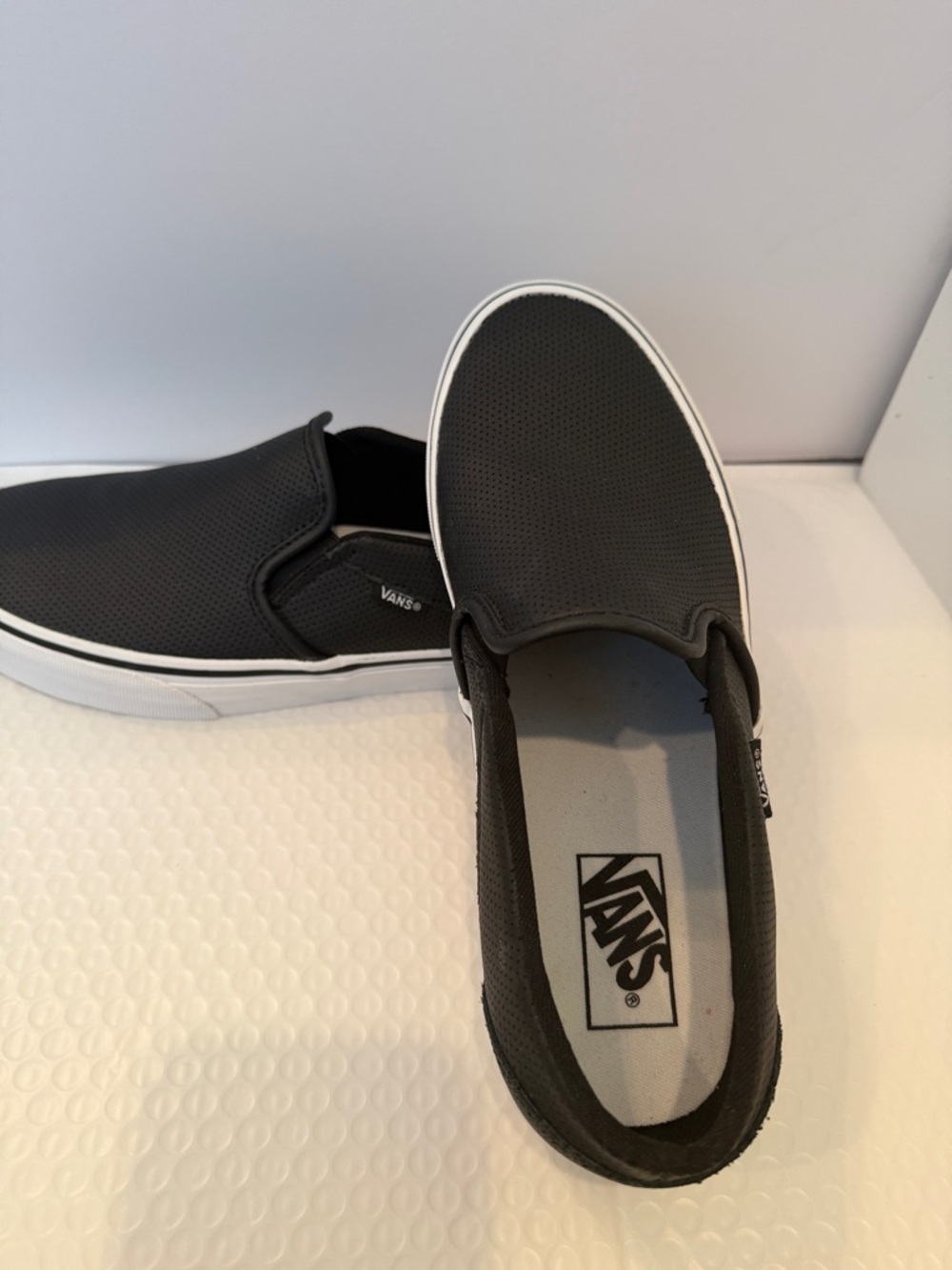 Vans Women’s  Slip-On Sneakersm in Black with White Outsole